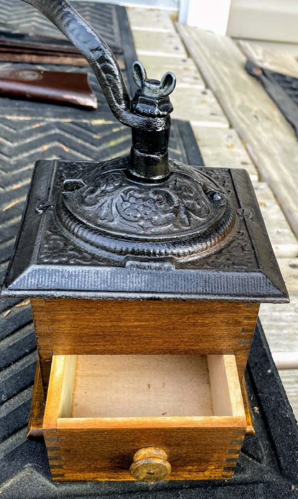 Vintage coffee grinder, Old retro hand-operated wooden and metal