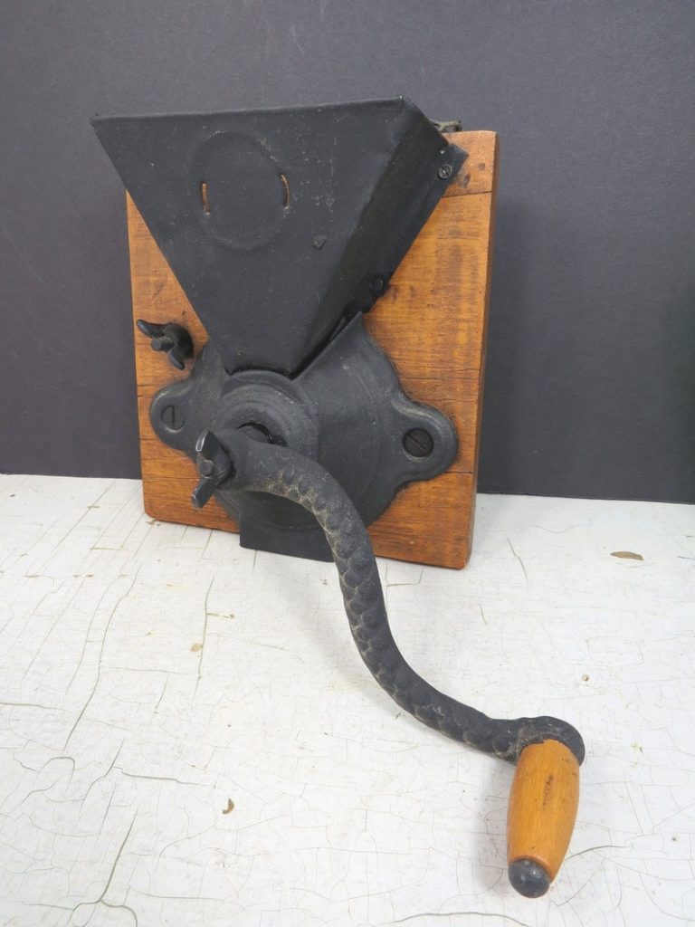 Vintage coffee grinder, Old retro hand-operated wooden and metal