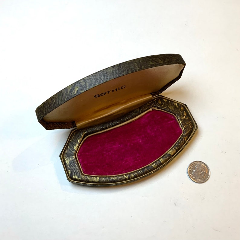 Small red jewelry box, with hinged lid