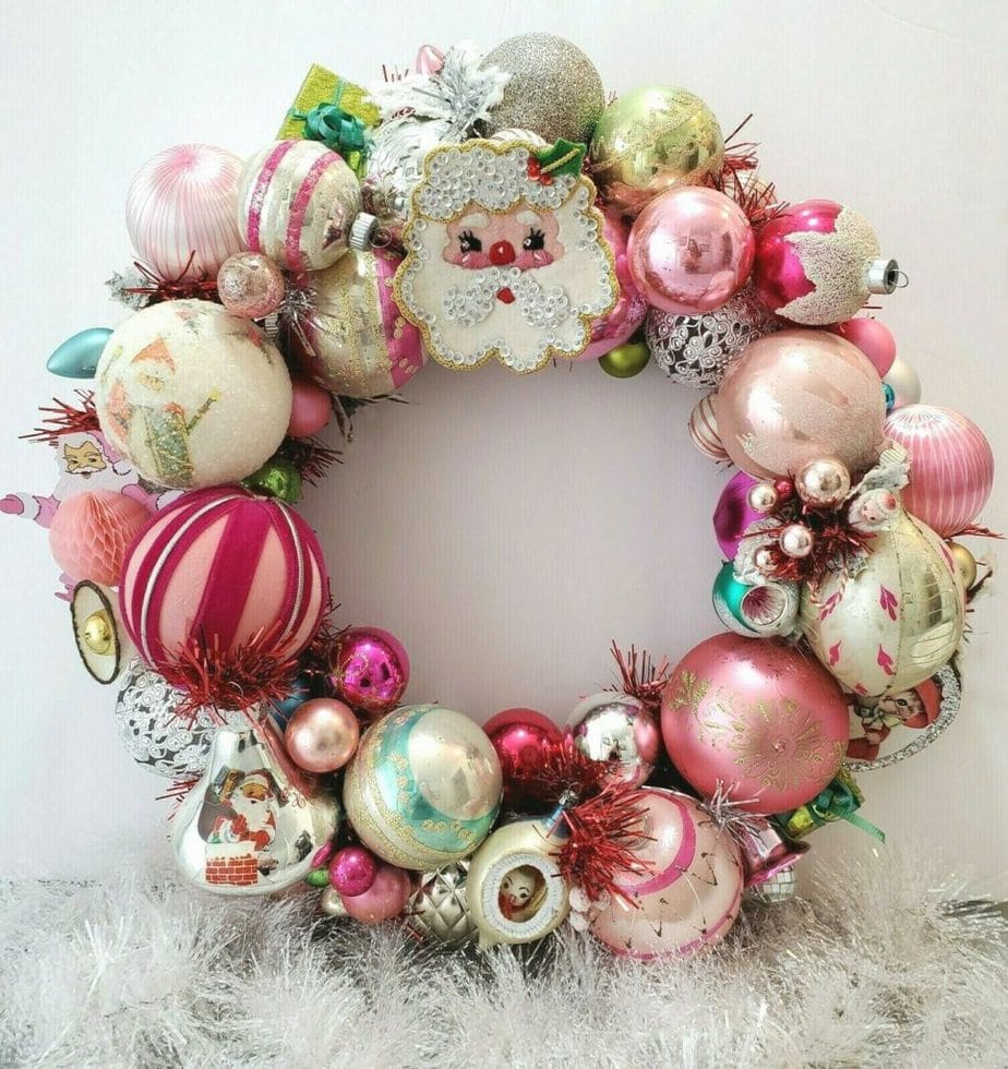 https://www.oldest.org/wp-content/uploads/2021/11/Vintage-Pink-Sequin-Santa-Ornament-Christmas-Wreath-965x1024.jpg